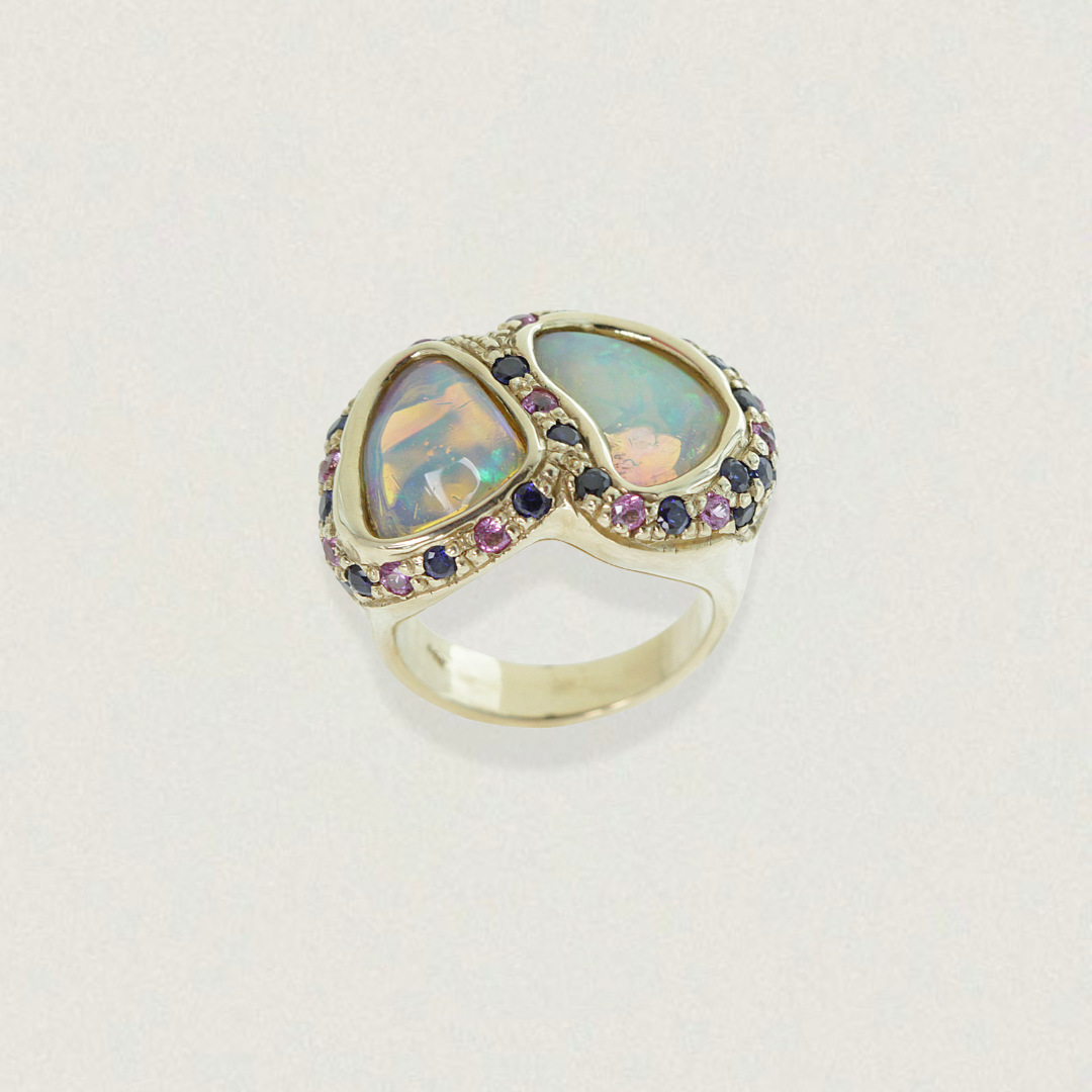 Front view of a 1.21ct Lightning Ridge double opal and sapphire cluster ring in 14ct yellow gold.
