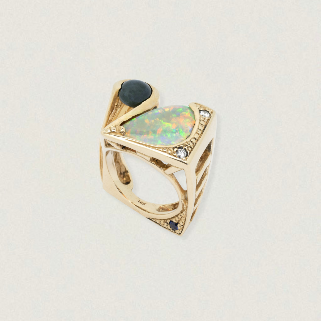 Front view of a 2.20ct Lightning Ridge opal, star sapphire and diamond ring in 14ct yellow gold with geometric shoulders.