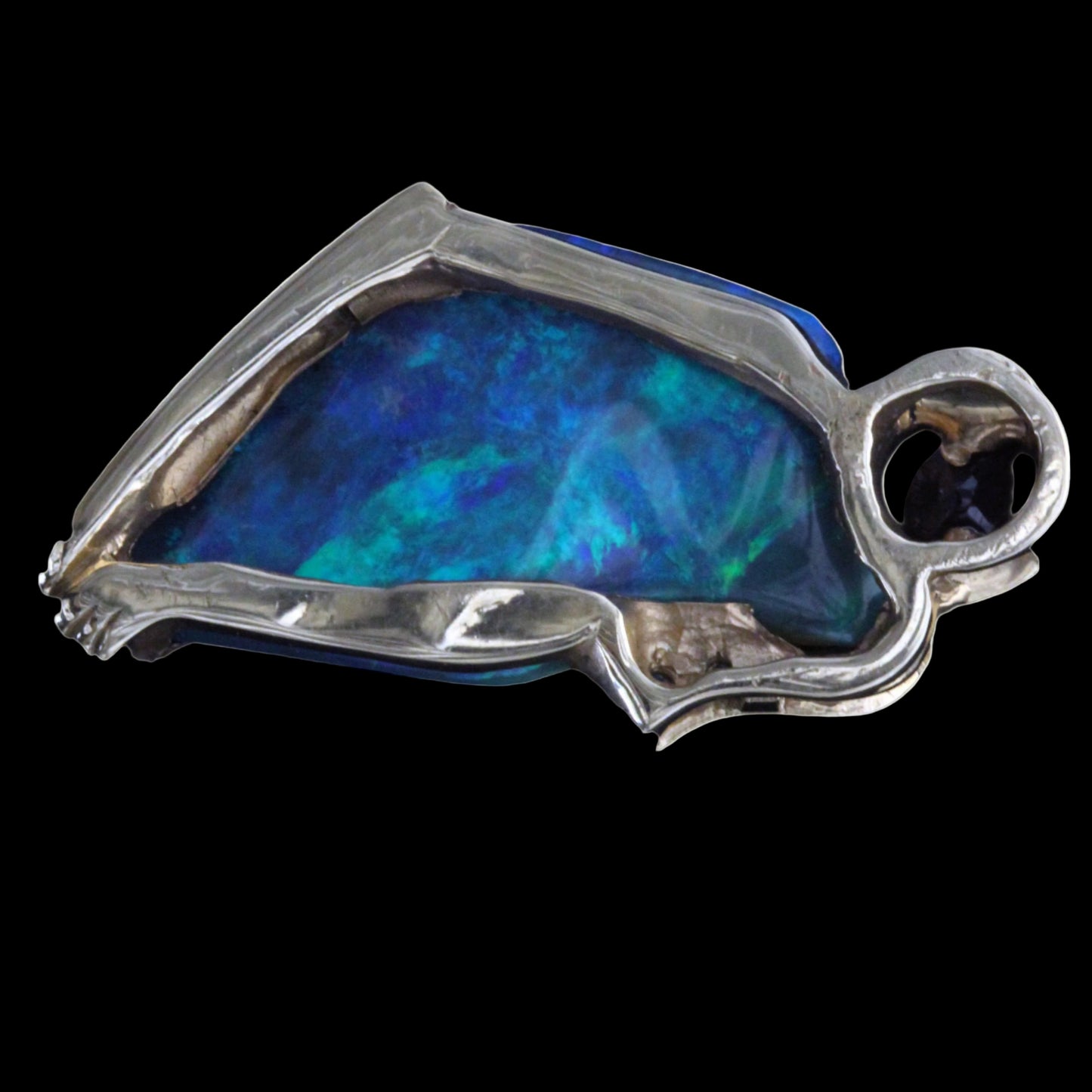 Reverse view of the pendant showing the bezel and gold framework behind the Lightning Ridge opal.