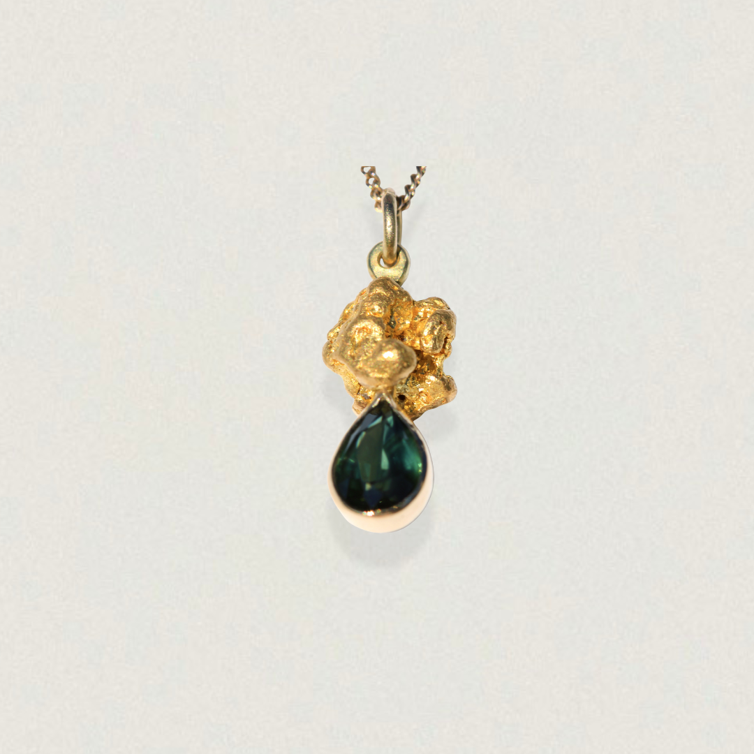 Australian parti sapphire teardrop pendant set beneath a natural gold nugget (92–98% pure gold) on a fine chain.