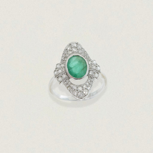 Art Deco engagement ring with 1.26ct oval emerald cabochon and diamond halo in 18ct white gold, product on light background.