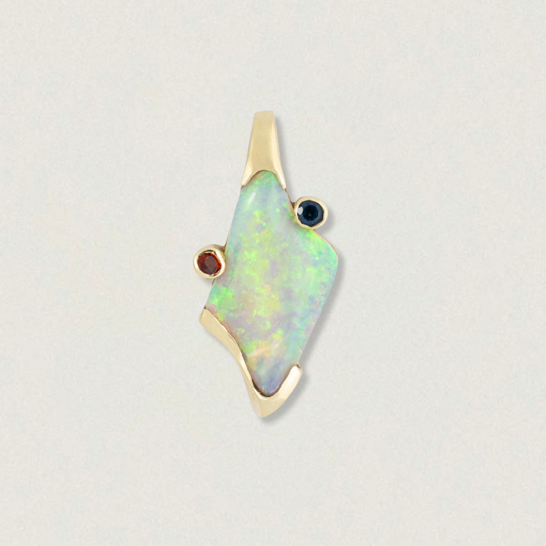 4.94ct Lightning Ridge crystal opal pendant with bezel-set orange and blue sapphires in an asymmetrical freeform design