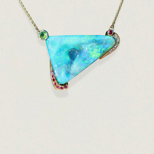 46.84ct Lightning Ridge opal pendant in 14ct yellow gold with diamond, garnet, peridot and pink sapphire accents.