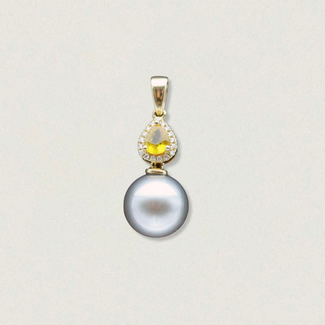 Vintage 14ct yellow gold pendant featuring a 0.45ct yellow sapphire with diamond halo above a grey Tahitian pearl, on white background.